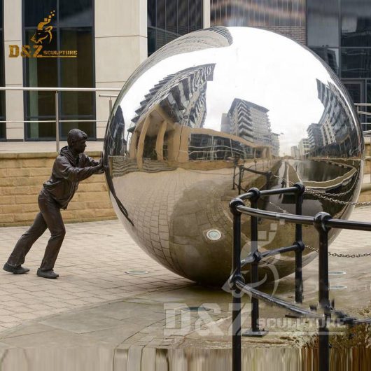 One person pushes the stainless steel ball sculpture large outdoor statue DZM 452
