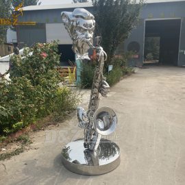 A abstract sculpture of a man playing the saxophone mirror finishing lawn ornament sculpture DZM 761