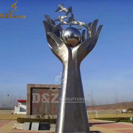 stainless steel hand with globe and dove sculpture for peace DZM 1049