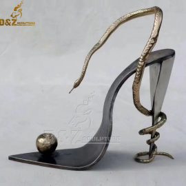 art modern large sculpture modern abstract sculpture Snake wrapped in high heels looking at apple sculpture DZM 1220