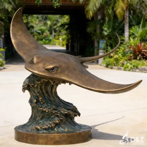 Large bronze stingray statue with wave base