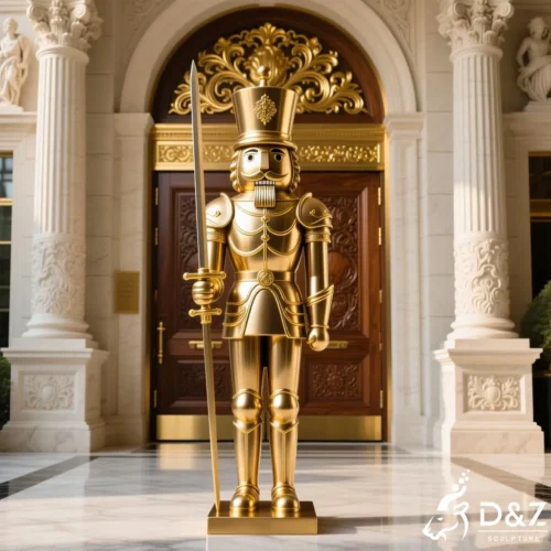 Giant gold nutcracker statue for outdoor Christmas commercial plaza decor.