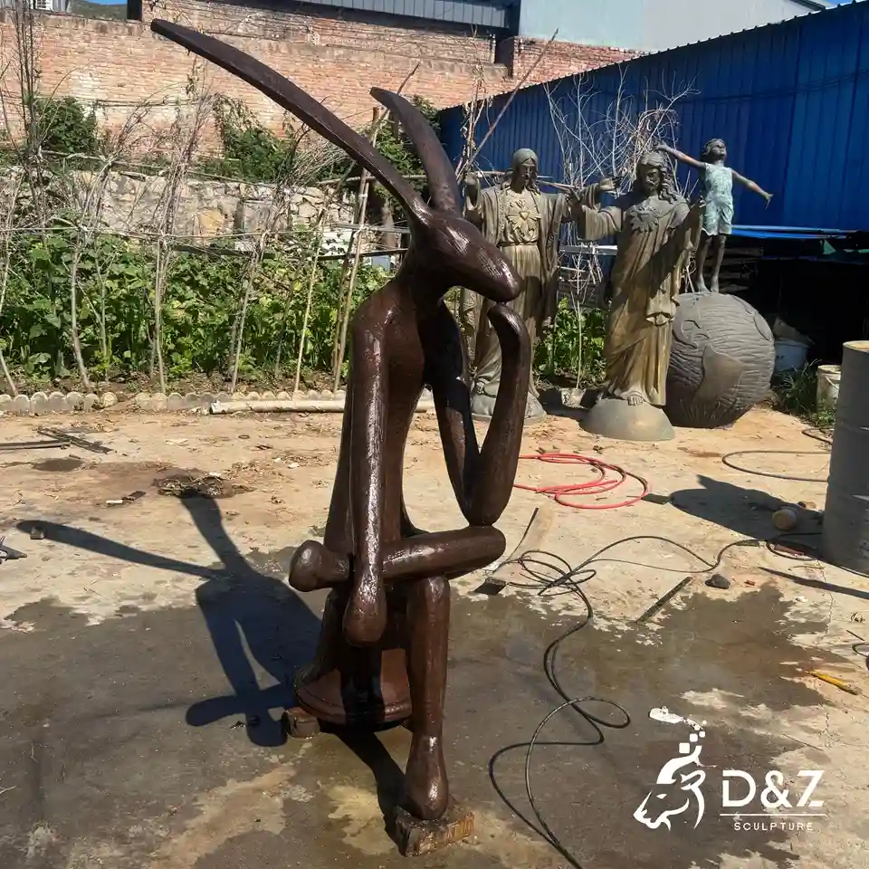 Bronze Thinking Rabbit Sculpture | Abstract Sitting Hare Statue For Outdoor Decor 2 Bronze Thinking Rabbit Sculpture | Abstract Sitting Hare Statue For Outdoor Decor 2