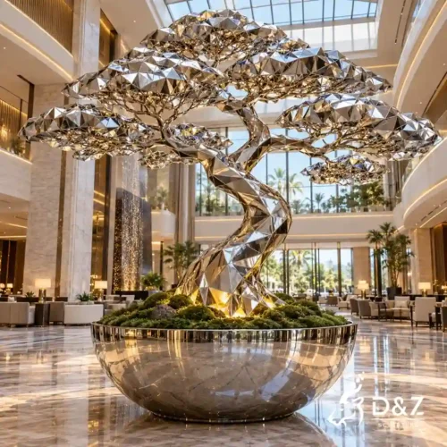 Large geometric tree sculpture with mirror stainless steel facets, bonsai-style canopy, LED lighting and round metal planter