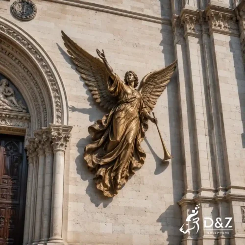 bronze angel wall statue with trumpet mounted on a stone church wall