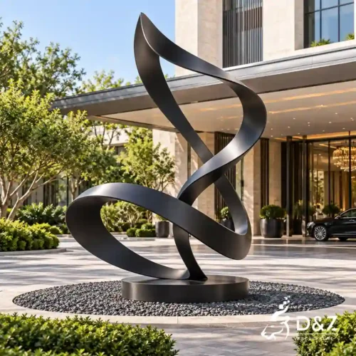 Black ribbon sculpture with flowing stainless steel form at a luxury hotel entrance Black ribbon sculpture with flowing stainless steel form at a luxury hotel entrance