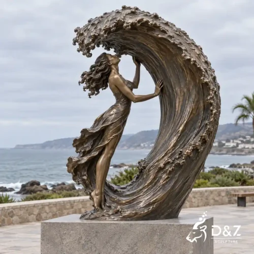 Kiss the sea sculpture featuring a bronze woman kissing a large curling ocean wave Kiss the sea sculpture featuring a bronze woman kissing a large curling ocean wave