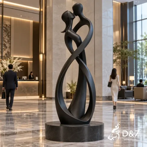 The kiss abstract sculpture in matte black stainless steel for a luxury hotel lobby