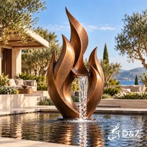 Large bronze abstract water fountain featuring a flame-inspired design and central waterfall in a luxury villa courtyard.