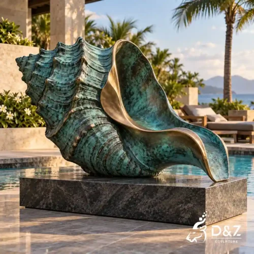 conch shell sculpture with detailed spiral ridges and verdigris bronze finish beside a resort swimming pool