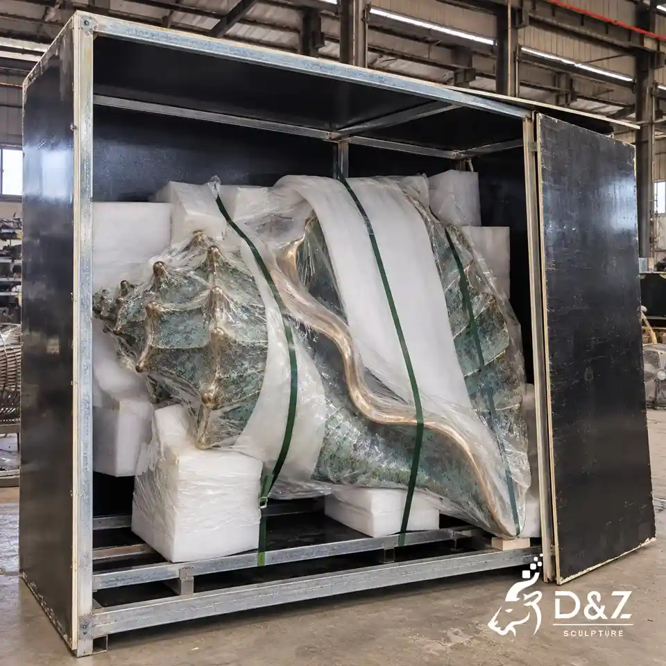 bronze shell sculpture wrapped in protective foam and secured with green straps inside a metal shipping frame bronze shell sculpture wrapped in protective foam and secured with green straps inside a metal shipping frame